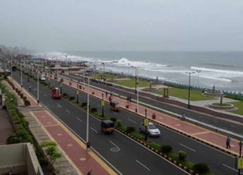 Public representatives stand against the tourism project at Vizag beach