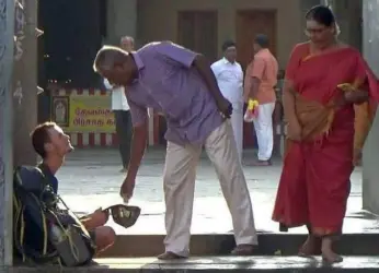 Russian tourist begs outside a temple after his ATM pin gets locked