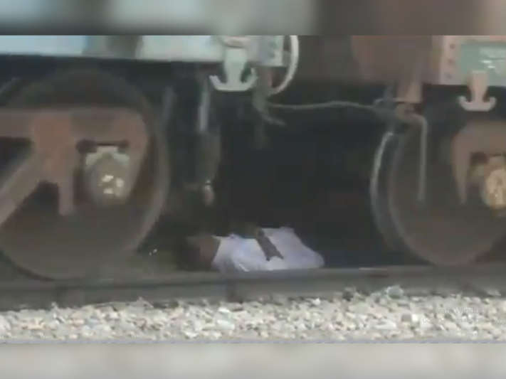 Andhra Pradesh man escapes unhurt after being stuck under a moving train
