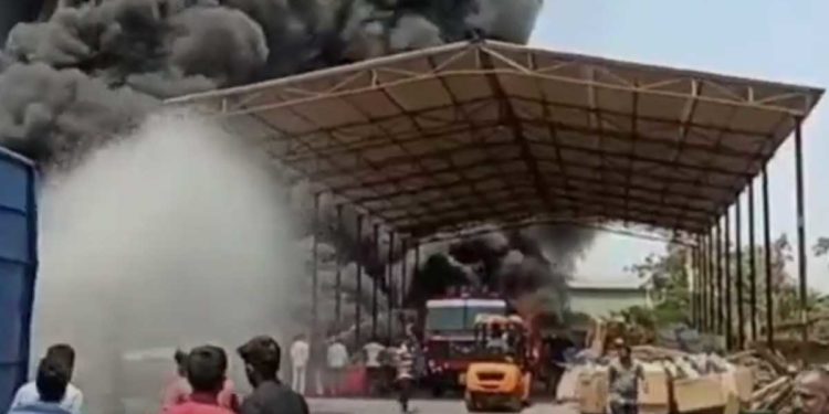 Fire officials trying to douse the fire at the scrapyard in Duvvada, Visakhapatnam