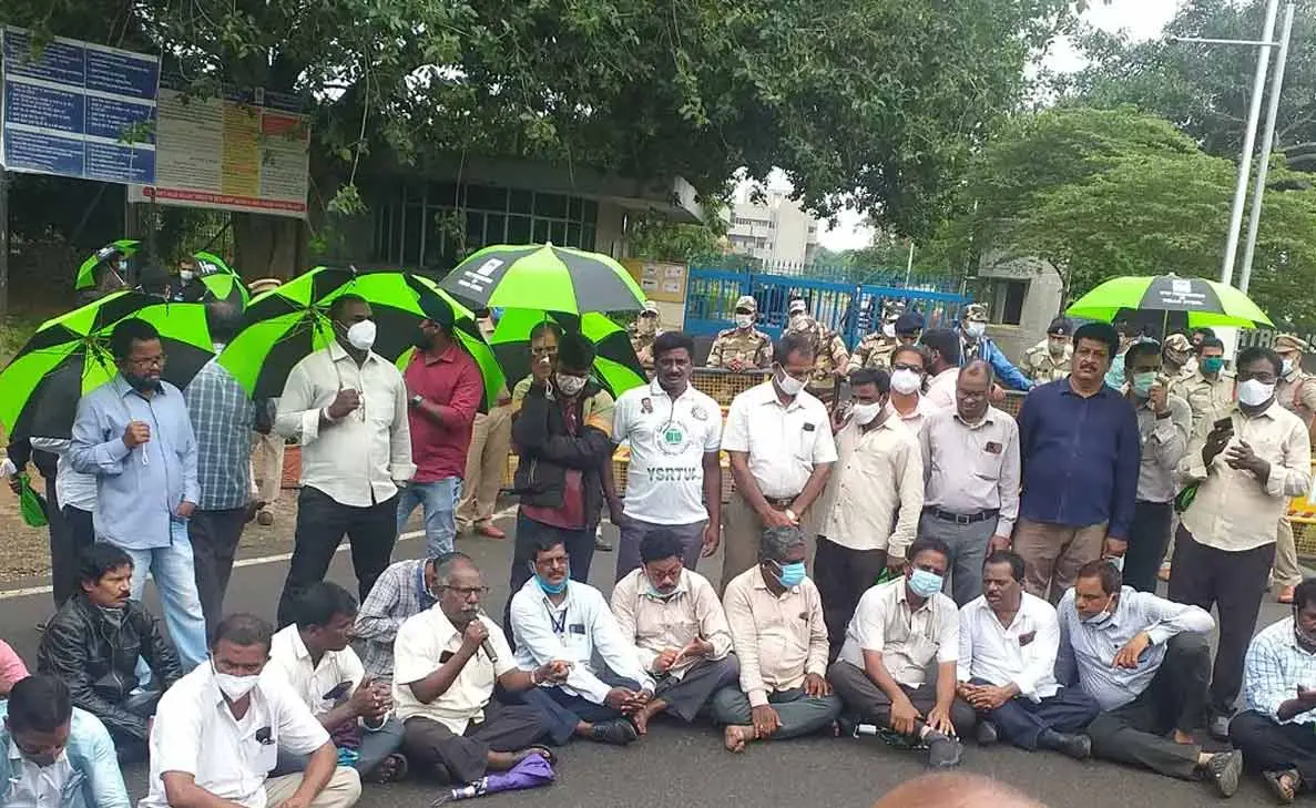 Steel Plant workers protest under the rain against RINL disinvestment