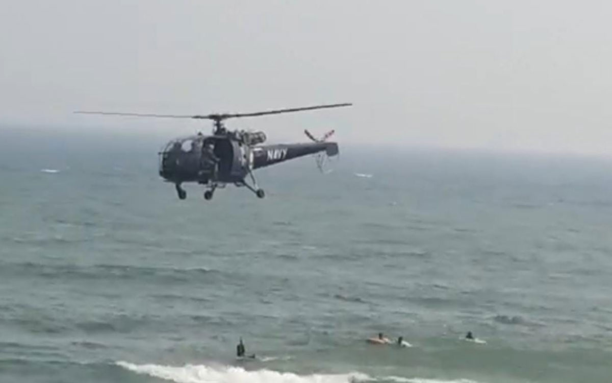 Navy Helicopters search for missing persons drowned at RK Beach