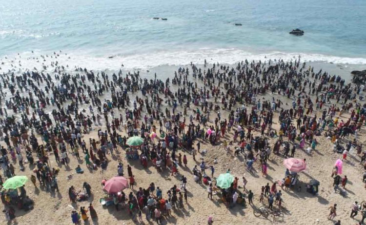 Crowds flock to Vizag beach to take a holy dip post Maha Shivarathri