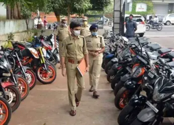 Vizag City Police destroy 631 loud silencers at RK Beach Road