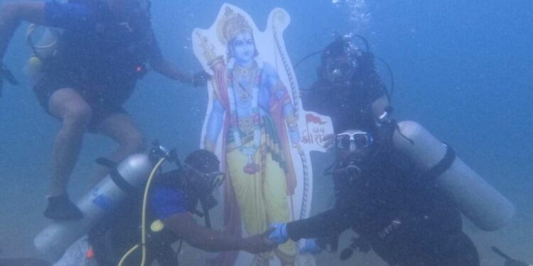 Scuba divers immerse a Ram Idol underwater at Rushikonda