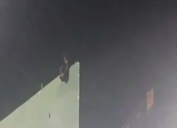 Vizag: Youth climbs hoarding and threatens suicide, rescued after four hours