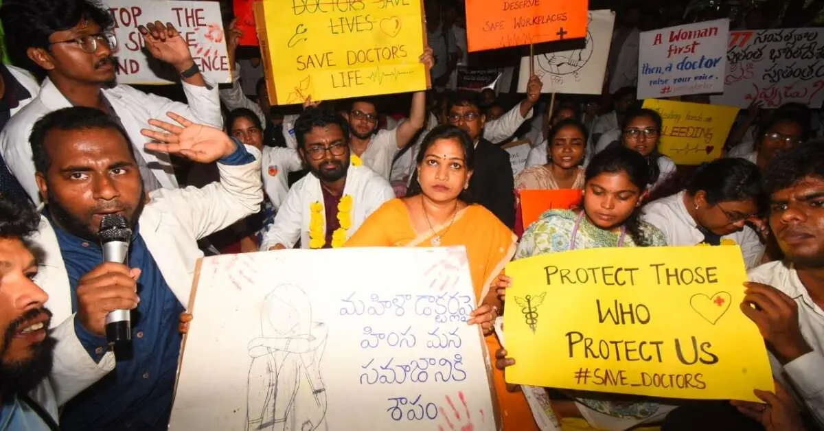 Home Minister Vangalapudi Anitha stands with doctors at protest in Visakhapatnam